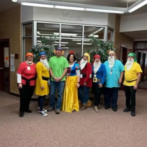 Mrs. Nielsen as snow white with her dwarfs 